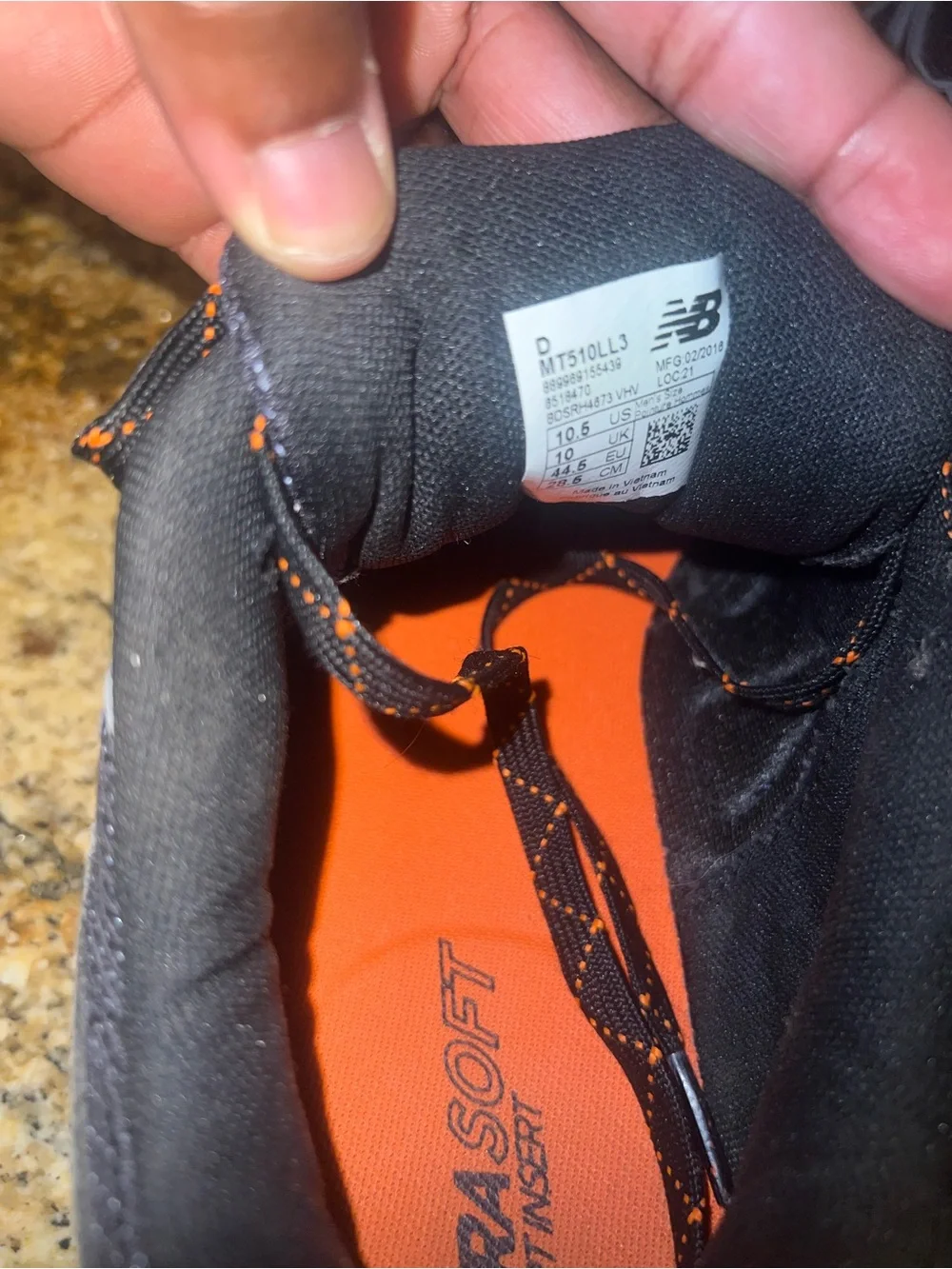 New Balance Men’s Black and Gray Athletic Trail Shoes with Orange Accents